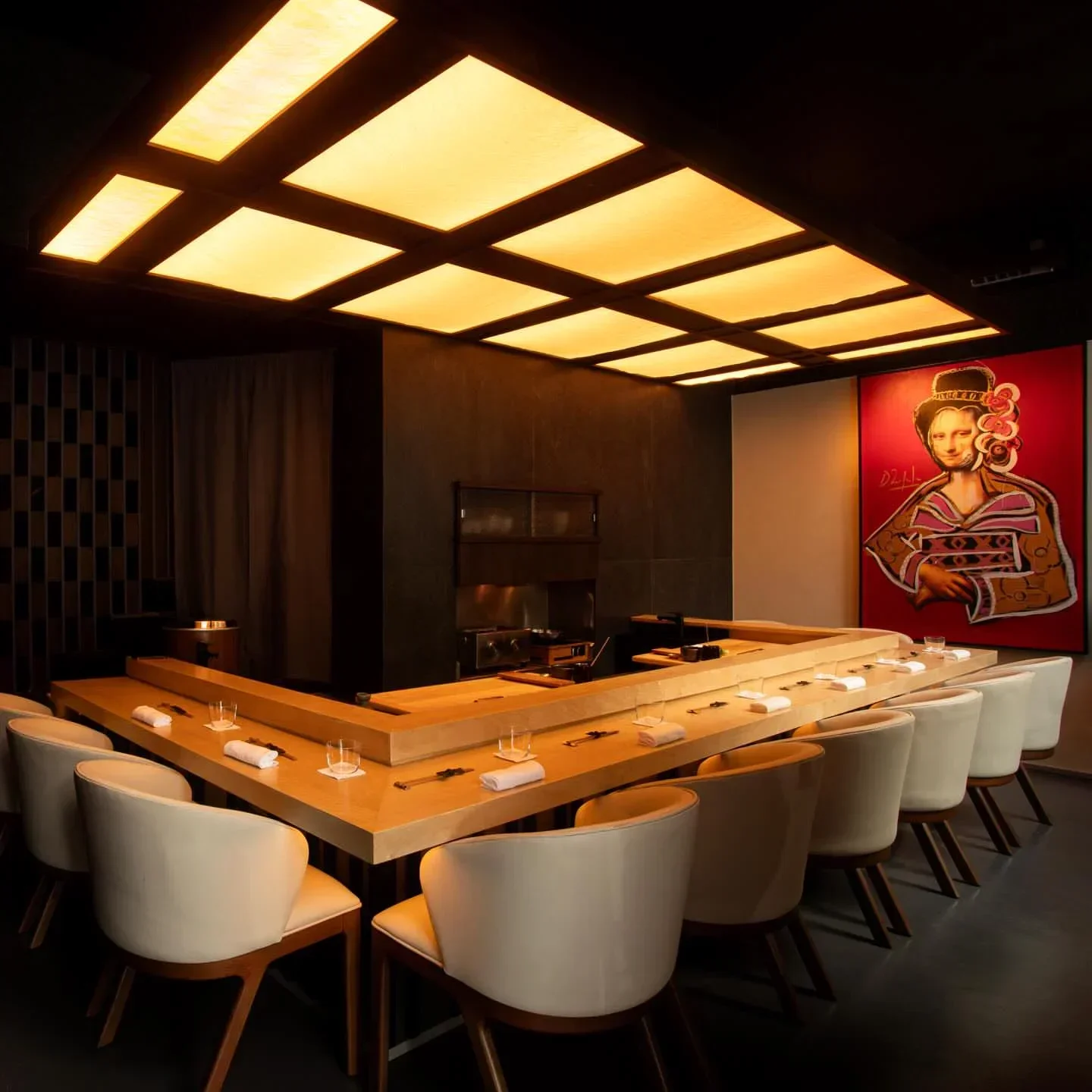 Interior of Kuro restaurant in Sao Paulo, with sushi bar and modern art.