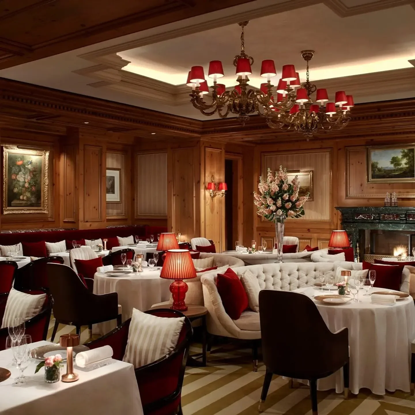 Elegant interior of La Baie restaurant in Osaka, with tables and a fireplace.