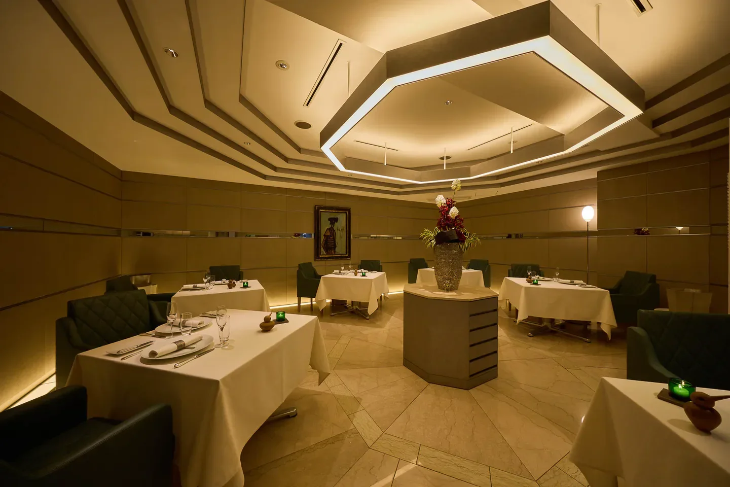 Elegant interior of La Bécasse restaurant in Osaka, with tables set for dining