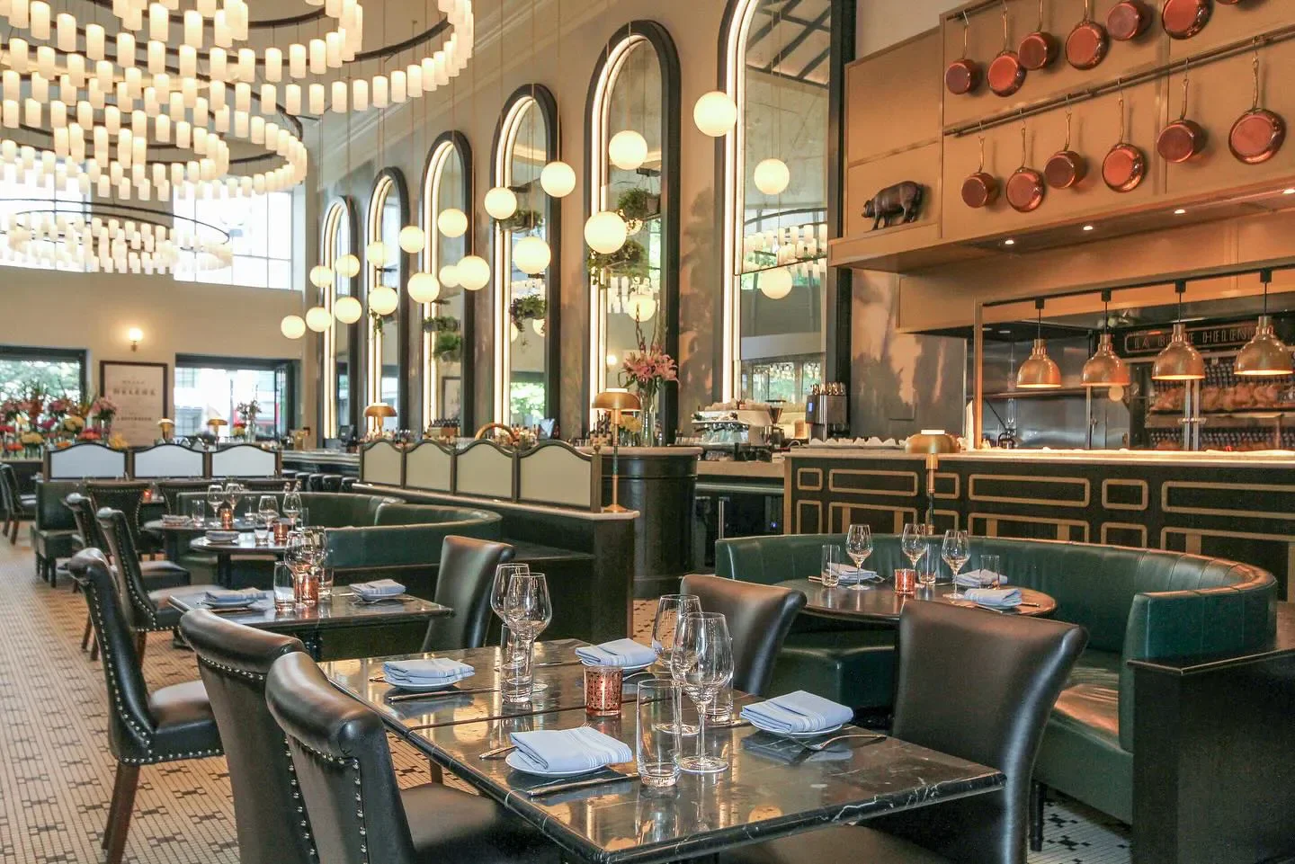 Elegant dining room interior at La Belle Helene in Charlotte with stylish decor.
