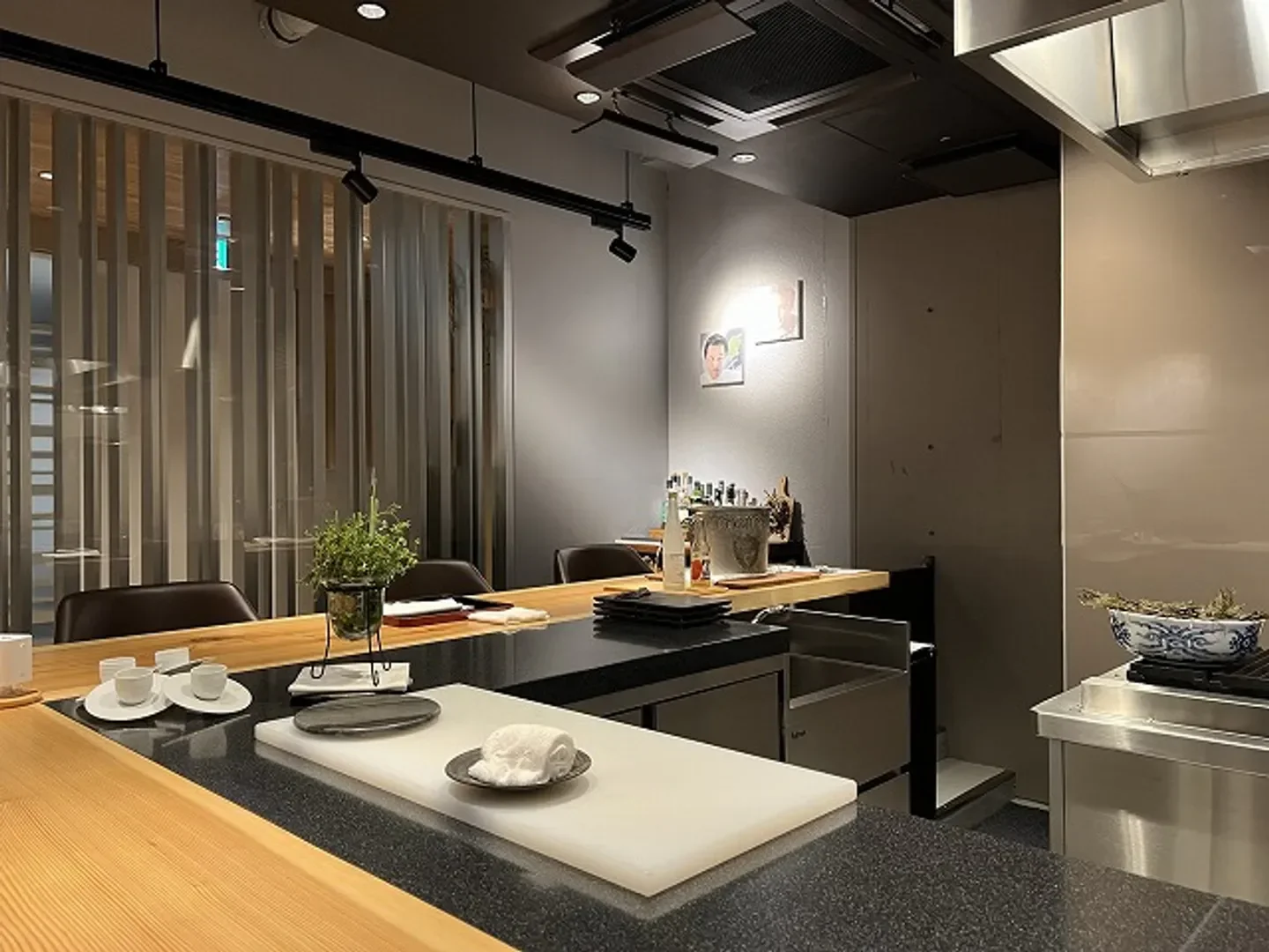 Interior of La Biographie restaurant in Kyoto, featuring a stylish dining counter.