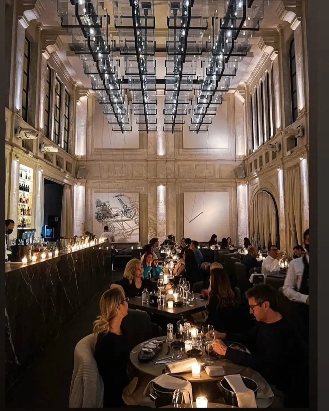 Dining at La Bullona restaurant in Milan, featuring elegant lighting and ambiance.
