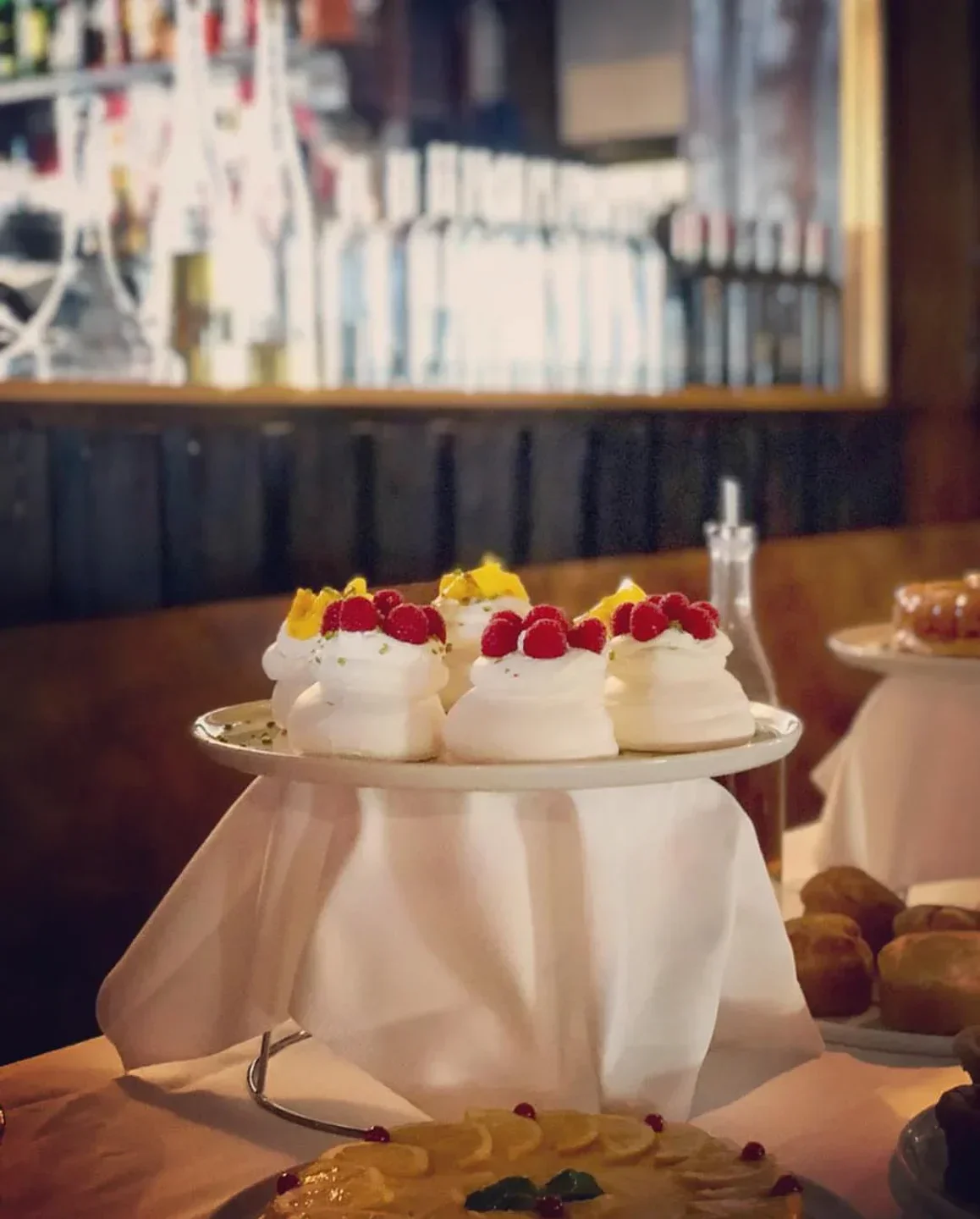 Delicious dessert display at La Casserole restaurant in Val-d'Isère, featuring fresh berries and cream.