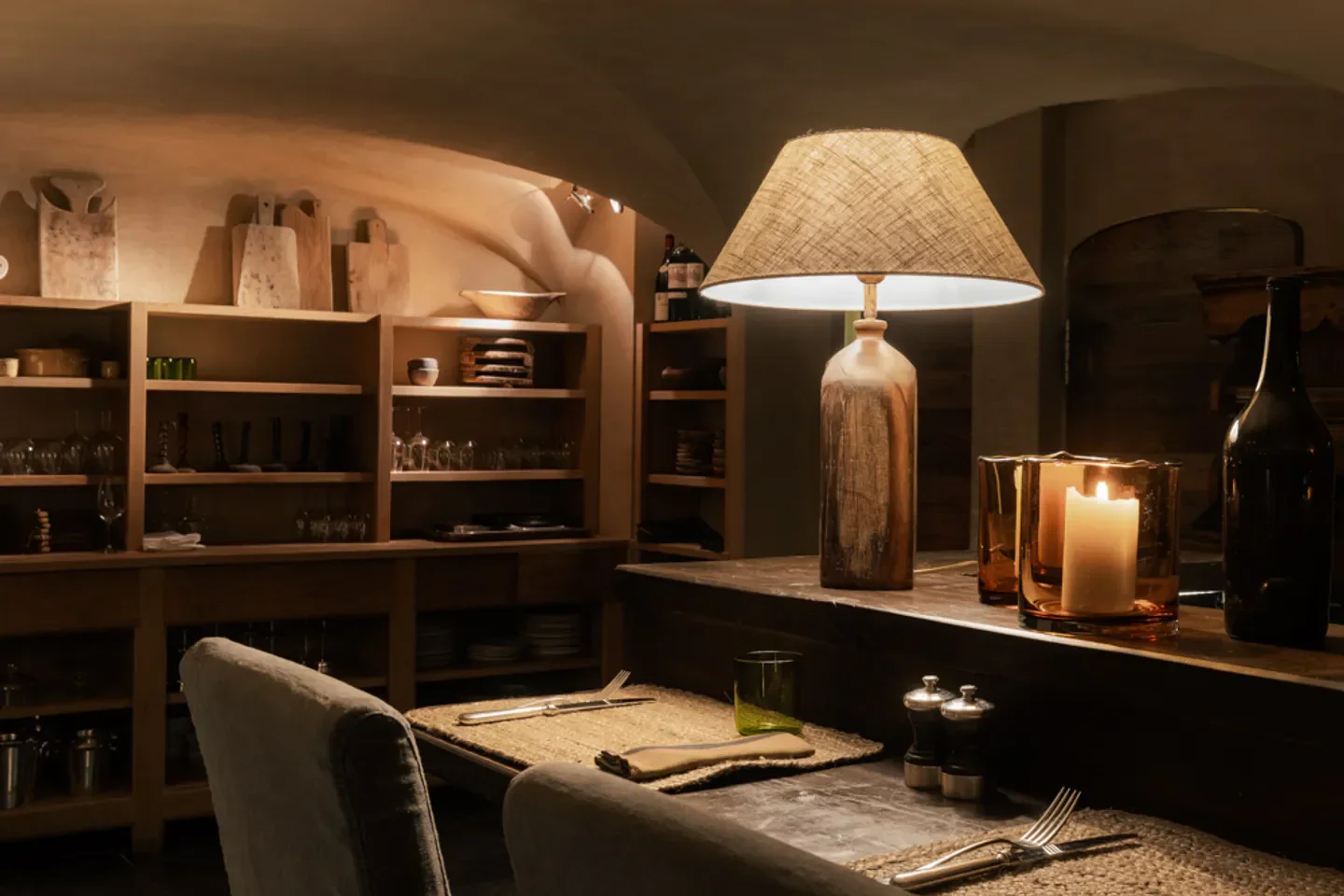 Cozy dining area at La Ferme de Mon Père restaurant in Megeve with warm lighting.