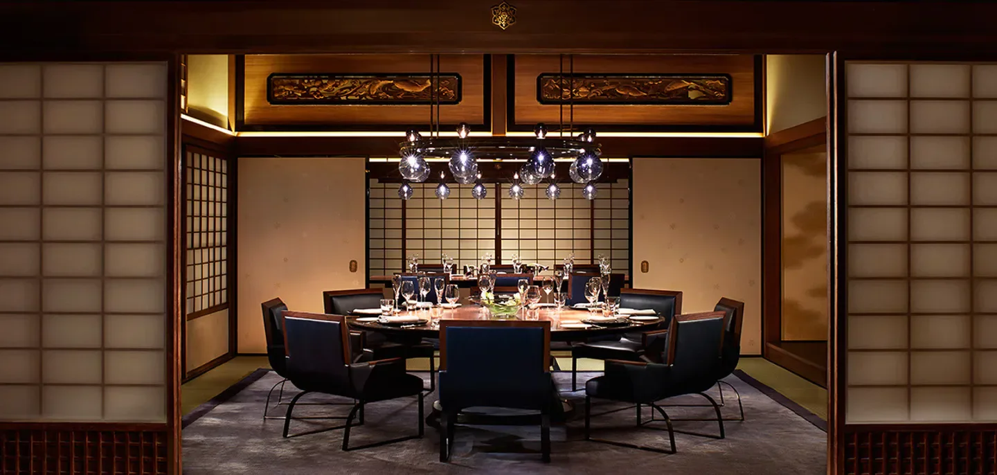 Elegant dining area at La Locanda restaurant in Kyoto, with stylish table setting.