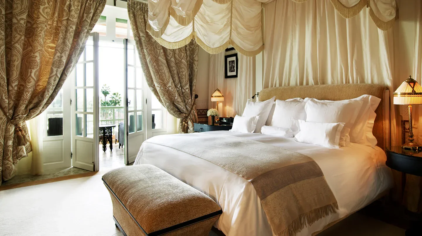Luxury bedroom at La Mamounia hotel in Marrakech with balcony view and elegant decor
