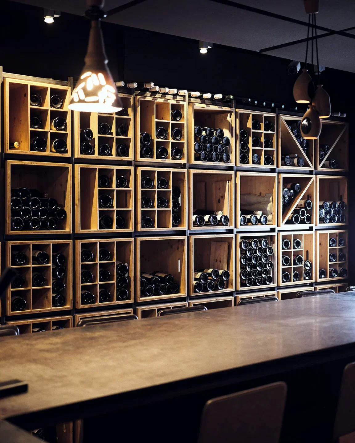 Wine cellar display at La Mère Brazier restaurant in Lyon, showcasing various selections.