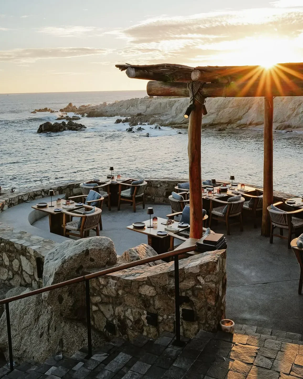 Sunset view from La Palapa restaurant in Los Cabos, overlooking the ocean.
