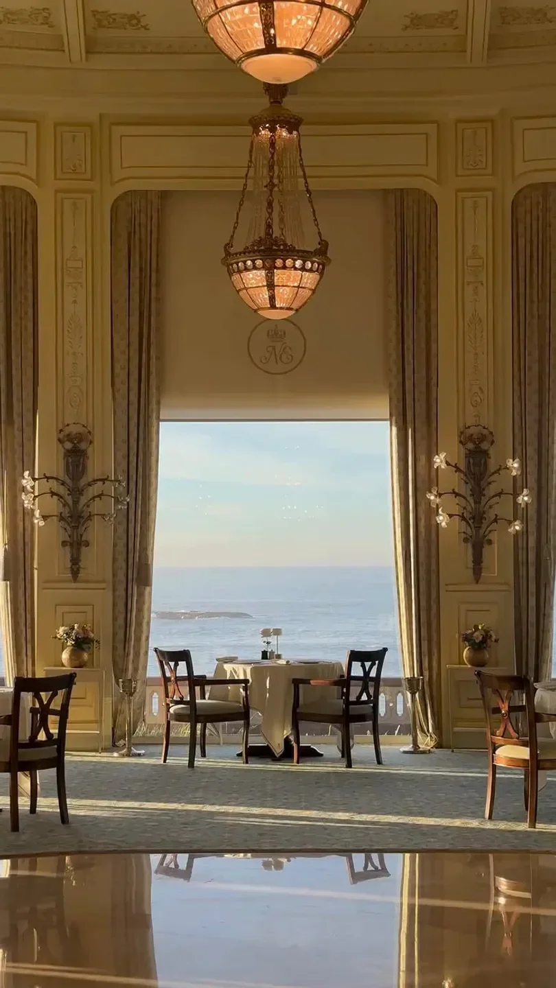 Elegant dining room at La Rotonde restaurant in Biarritz with ocean views.