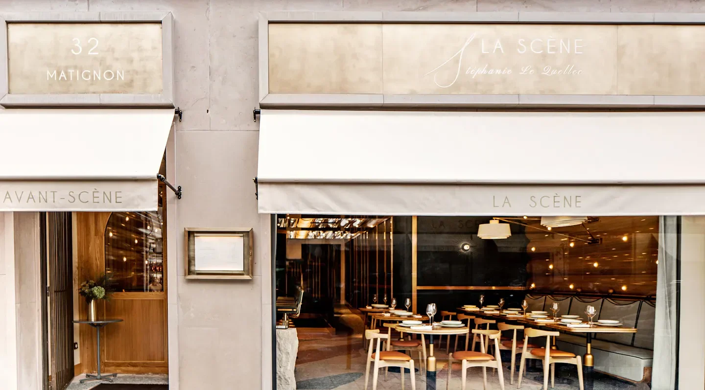 Exterior view of La Scène - Stéphanie Le Quellec restaurant in Paris with a peek inside.
