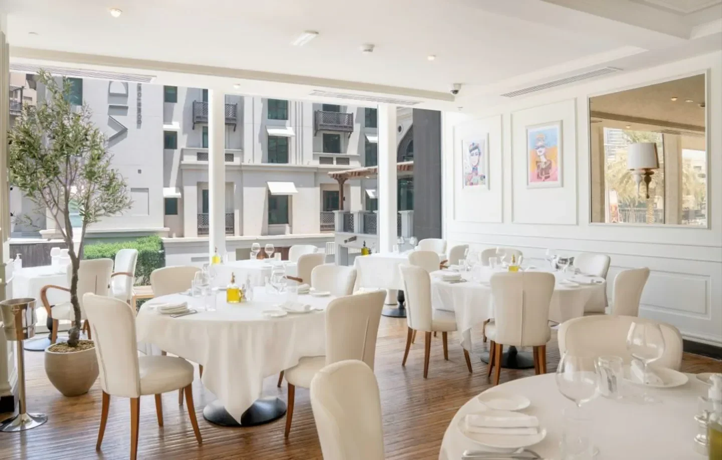 Elegant dining room at La Serre restaurant in Dubai, with a bright and airy atmosphere.
