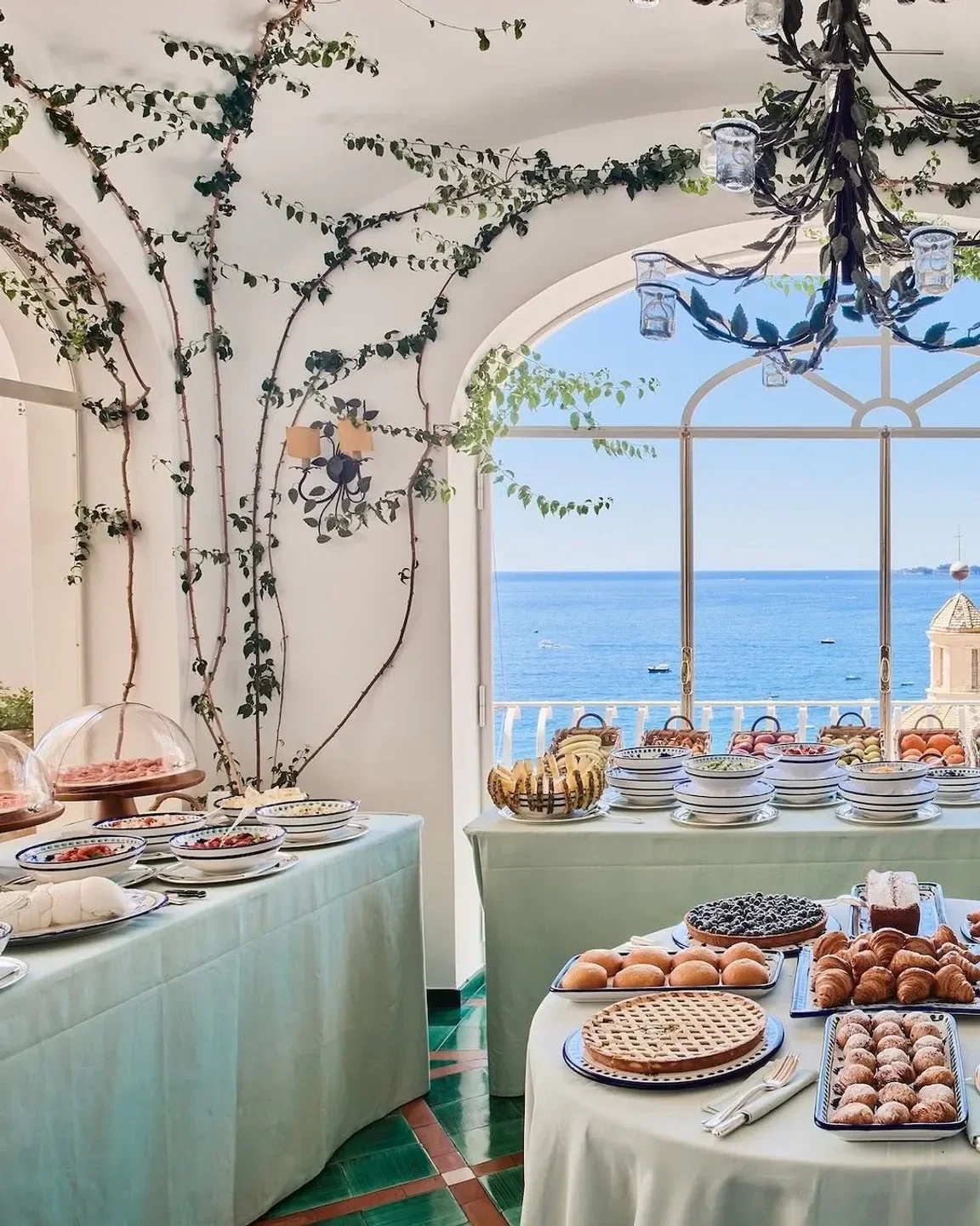 Breakfast buffet at La Sponda, Amalfi Coast restaurant, overlooking the Mediterranean Sea.