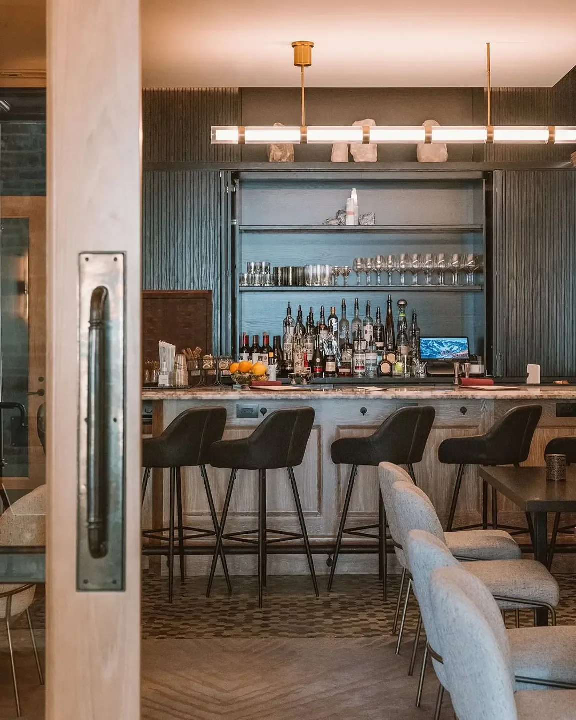 Interior bar at La Stellina restaurant in Park City with stools and inviting atmosphere
