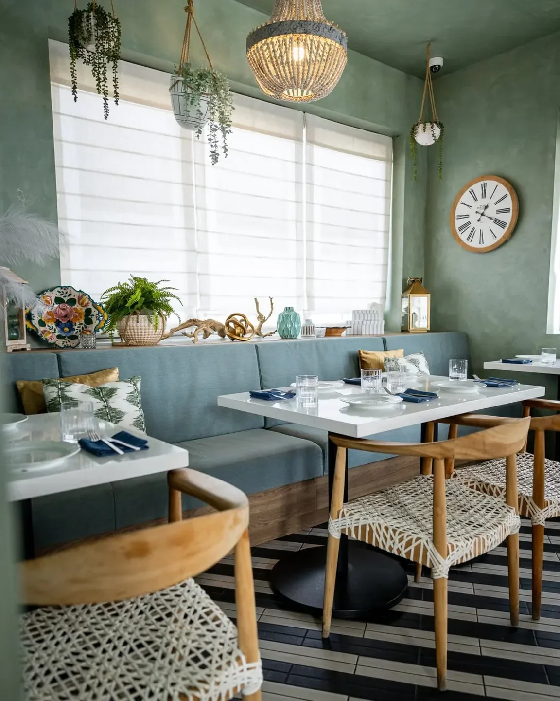 Cozy dining area at La Strega restaurant in Las Vegas, featuring wooden chairs and decor.