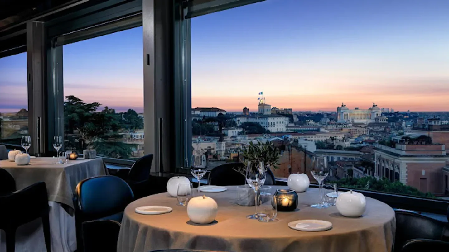 La Terrazza restaurant in Rome with a beautiful sunset view over the city.