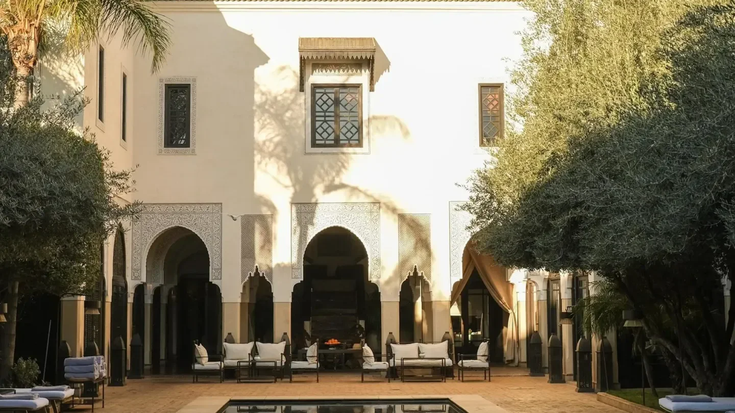 Courtyard entrance at La Villa des Orangers in Marrakech, elegant seating and architecture
