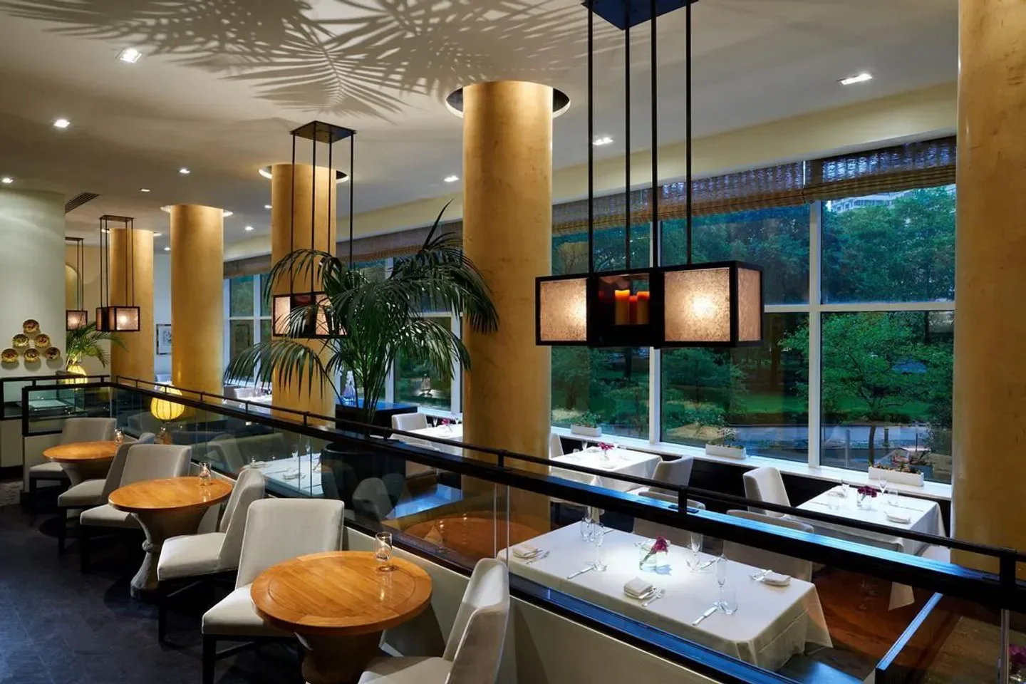 Elegant dining room at Lacroix in Philadelphia with a view, featuring stylish decor.