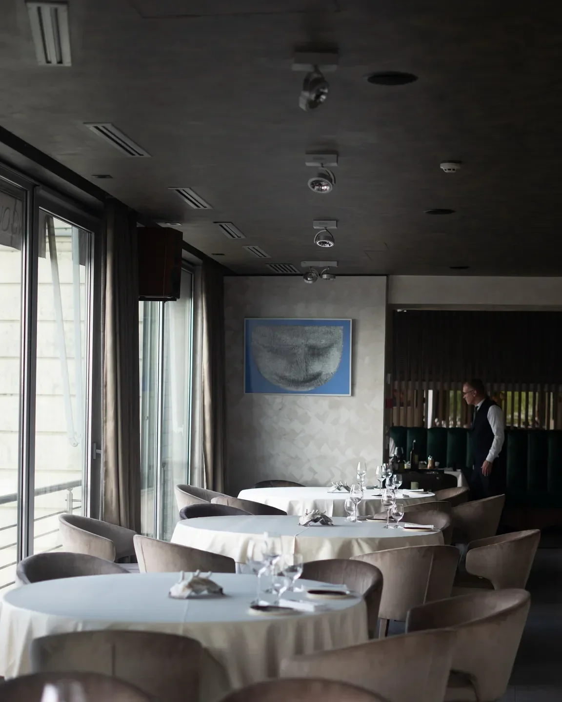 Elegant dining area at Langouste restaurant in Belgrade, showcasing tables and sophisticated decor.