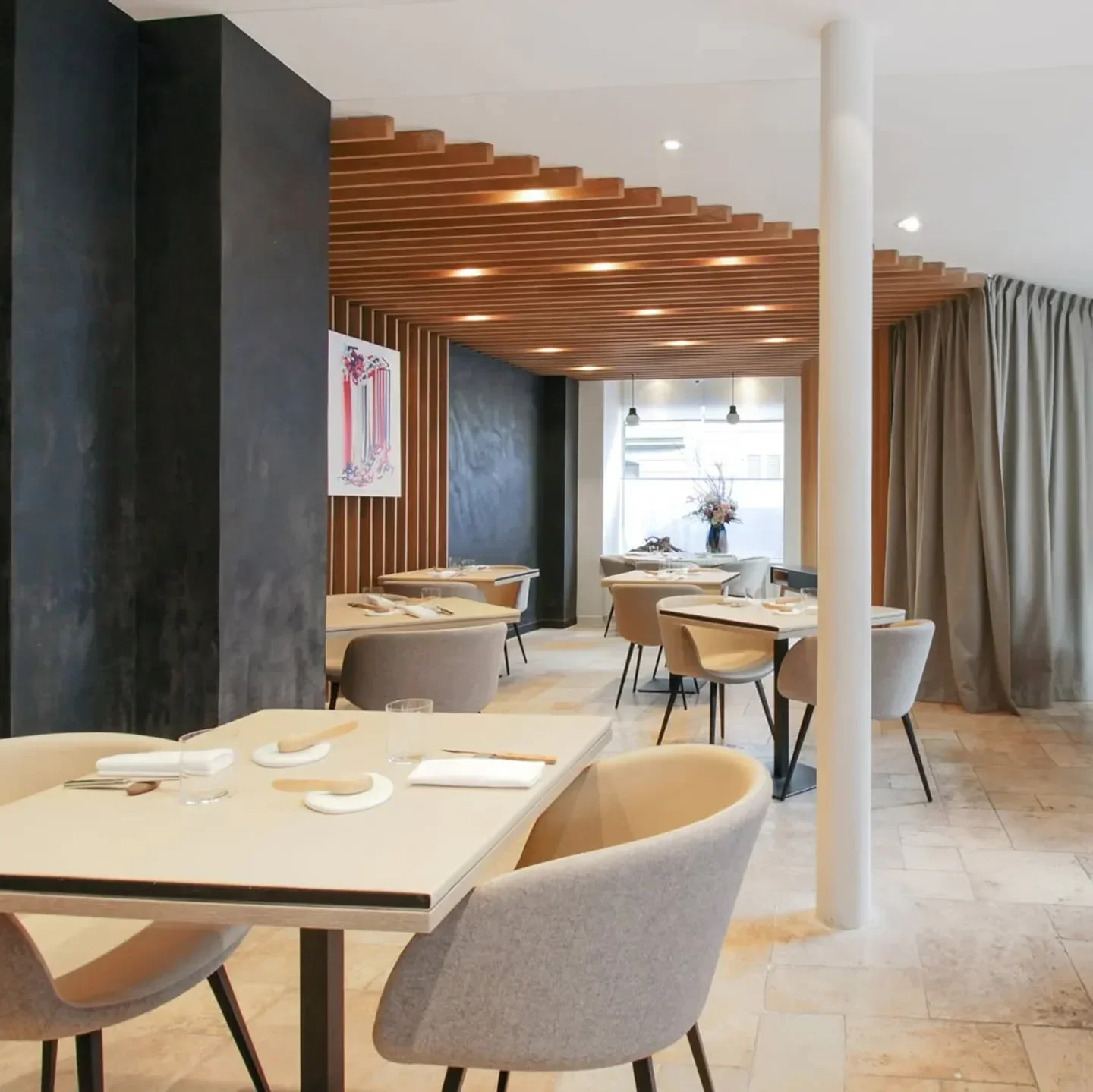 Interior of L'Archeste restaurant in Paris, showcasing elegant dining area with stylish decor.