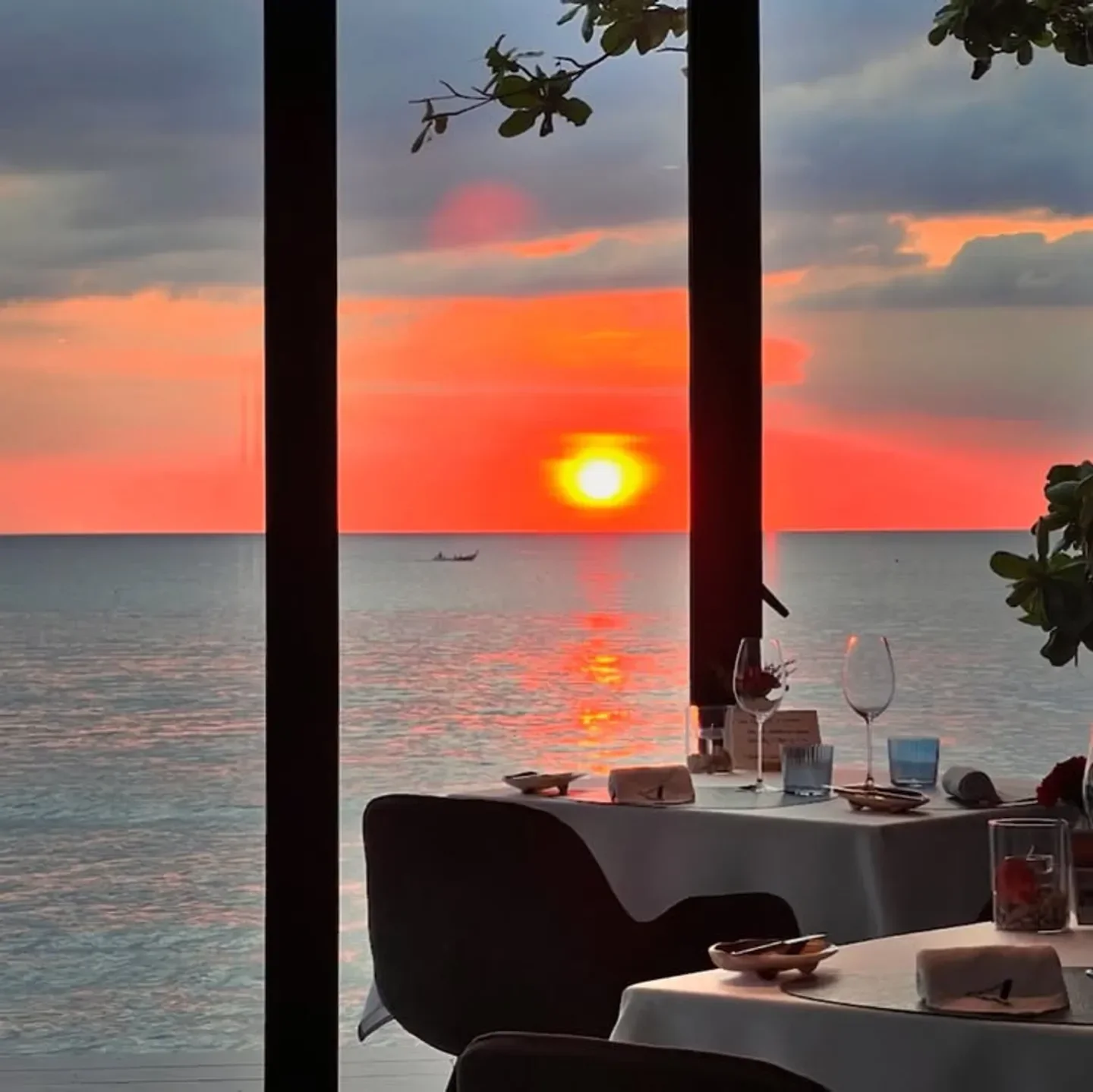 Stunning sunset view from L'Arôme by the Sea restaurant in Phuket, Thailand.