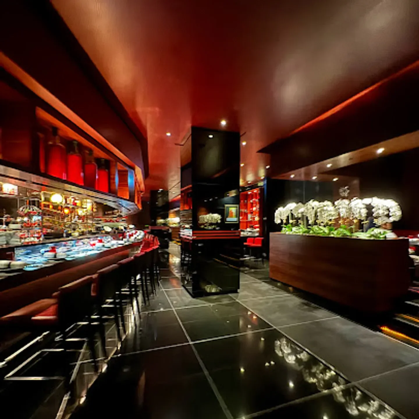 Interior of L'Atelier de Joel Robuchon restaurant in Taipei with sleek design and decor.