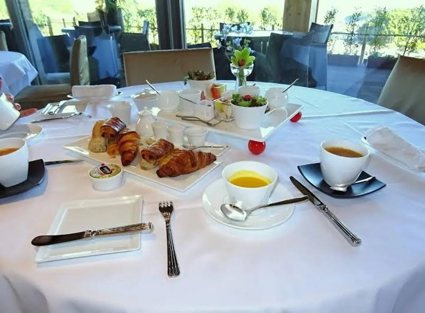 Breakfast table at L'AUBERGE DE PLAISANCE SAKURAI in Nara, with croissants and soup.