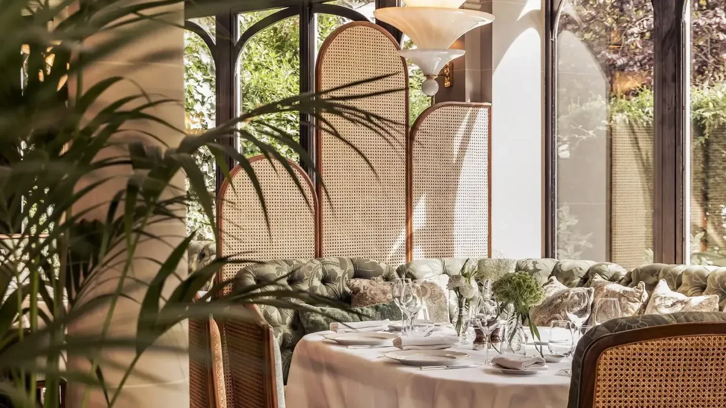 Elegant dining interior at Laurent restaurant in Paris, featuring stylish decor and refined table setting.