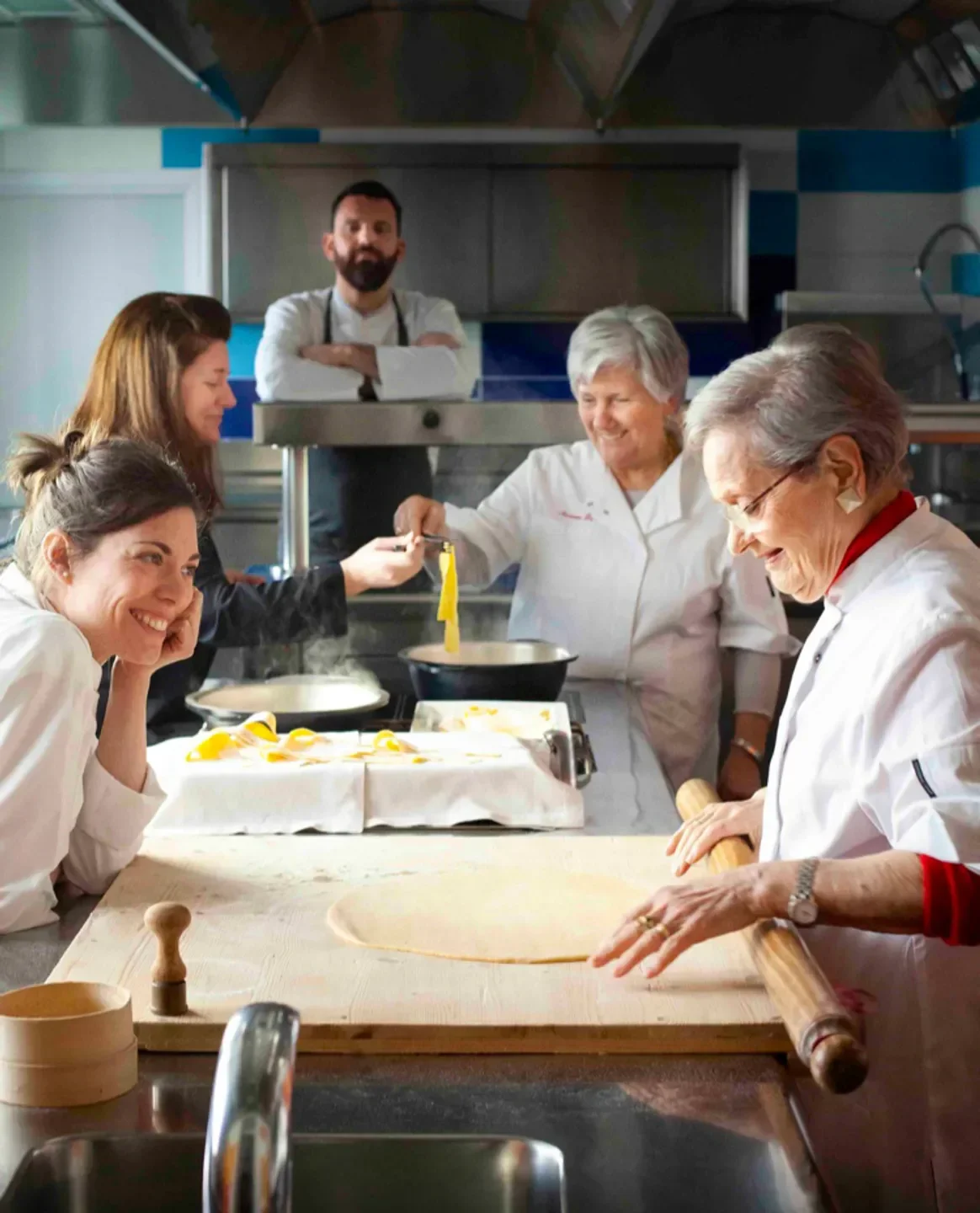 Chefs preparing fresh pasta at Lazzaro 1915 restaurant in Veneto, Italy