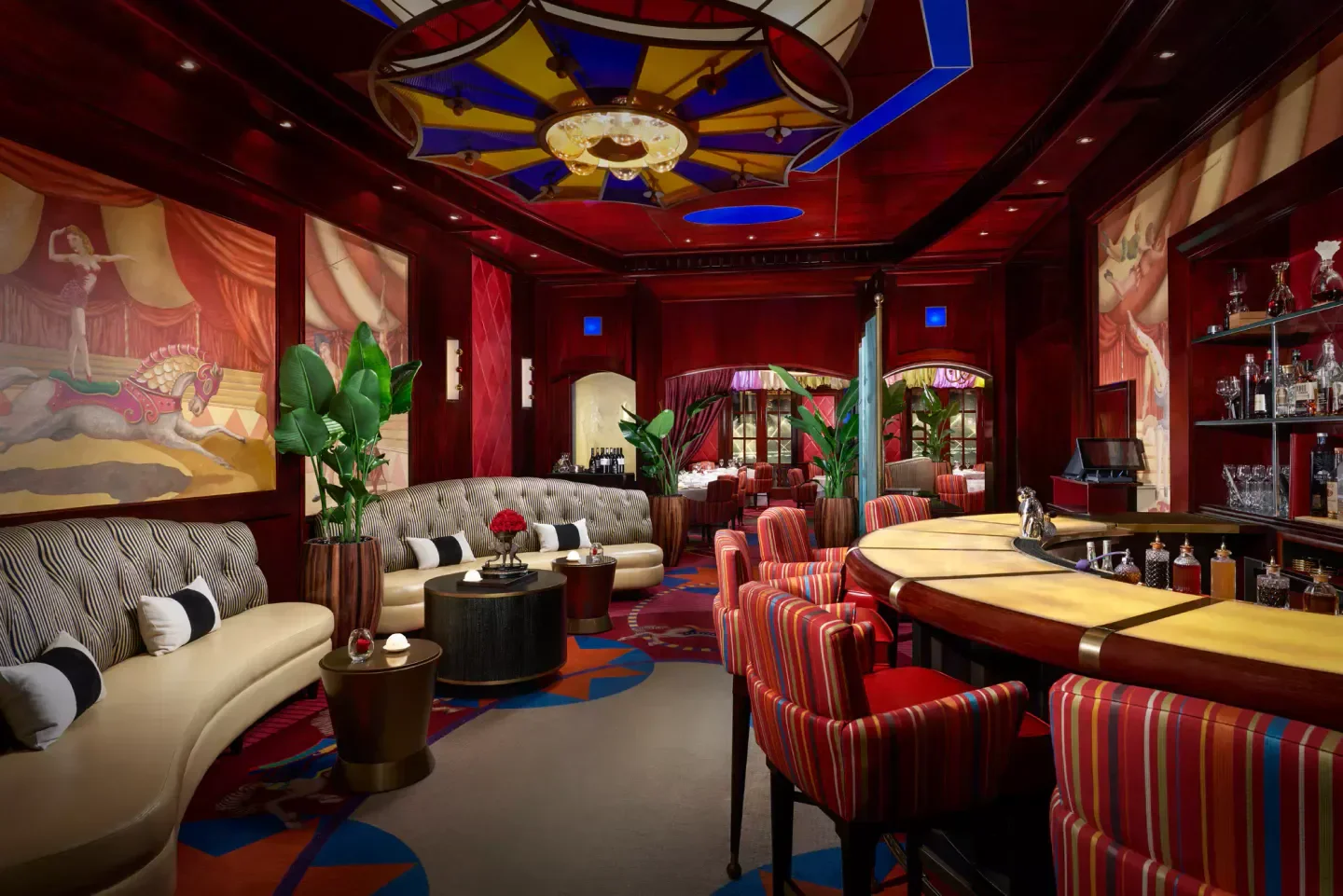 Interior of Le Cirque restaurant in Las Vegas, featuring bar and circus-themed decor.