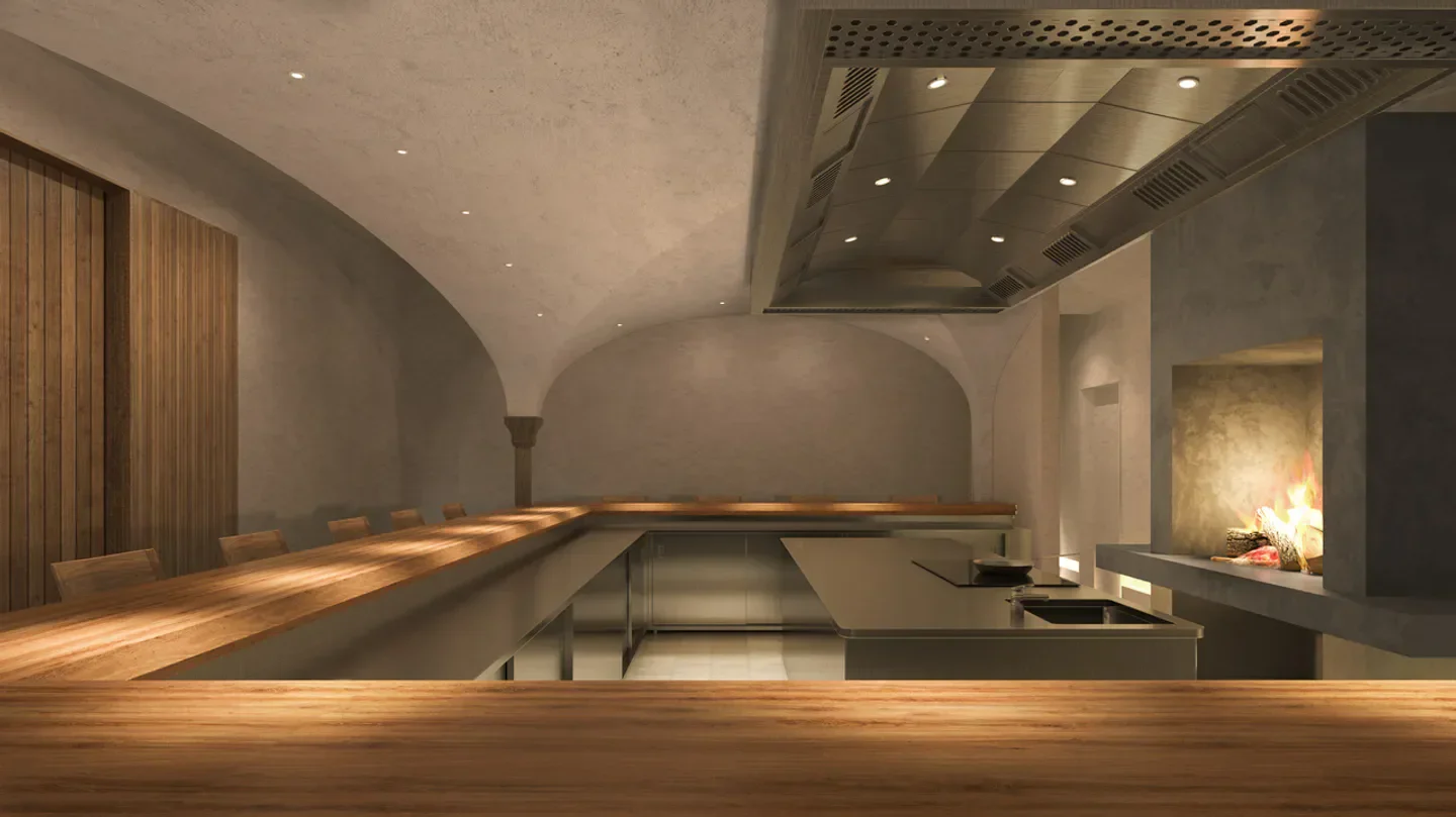 Interior of Le Pont de Ciel in Osaka, featuring a cozy fireplace and wooden tables.
