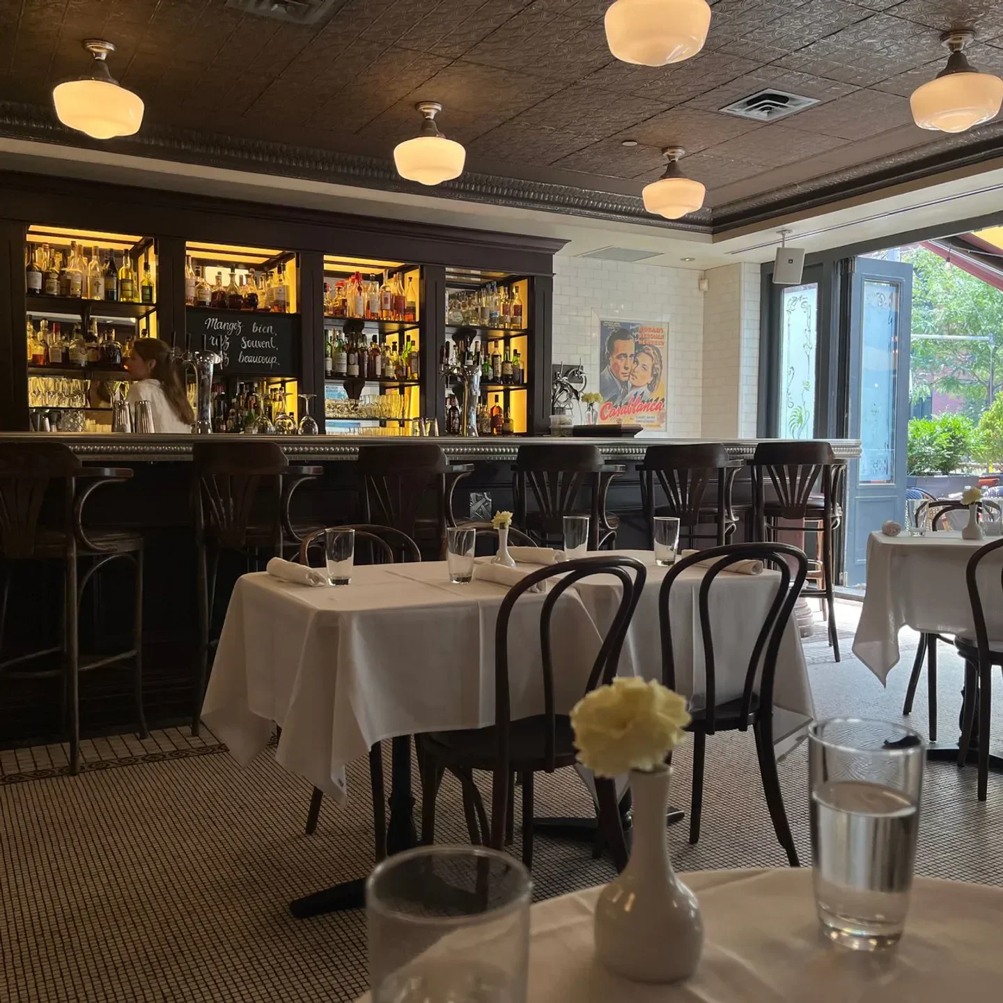 Interior view of Le Sélect Bistro in Toronto, with bar and dining tables.