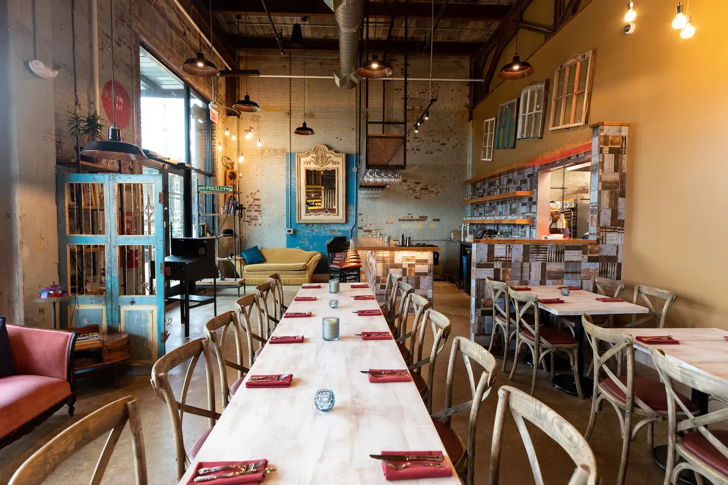 Interior of Leah & Louise restaurant in Charlotte, NC, featuring long table setting
