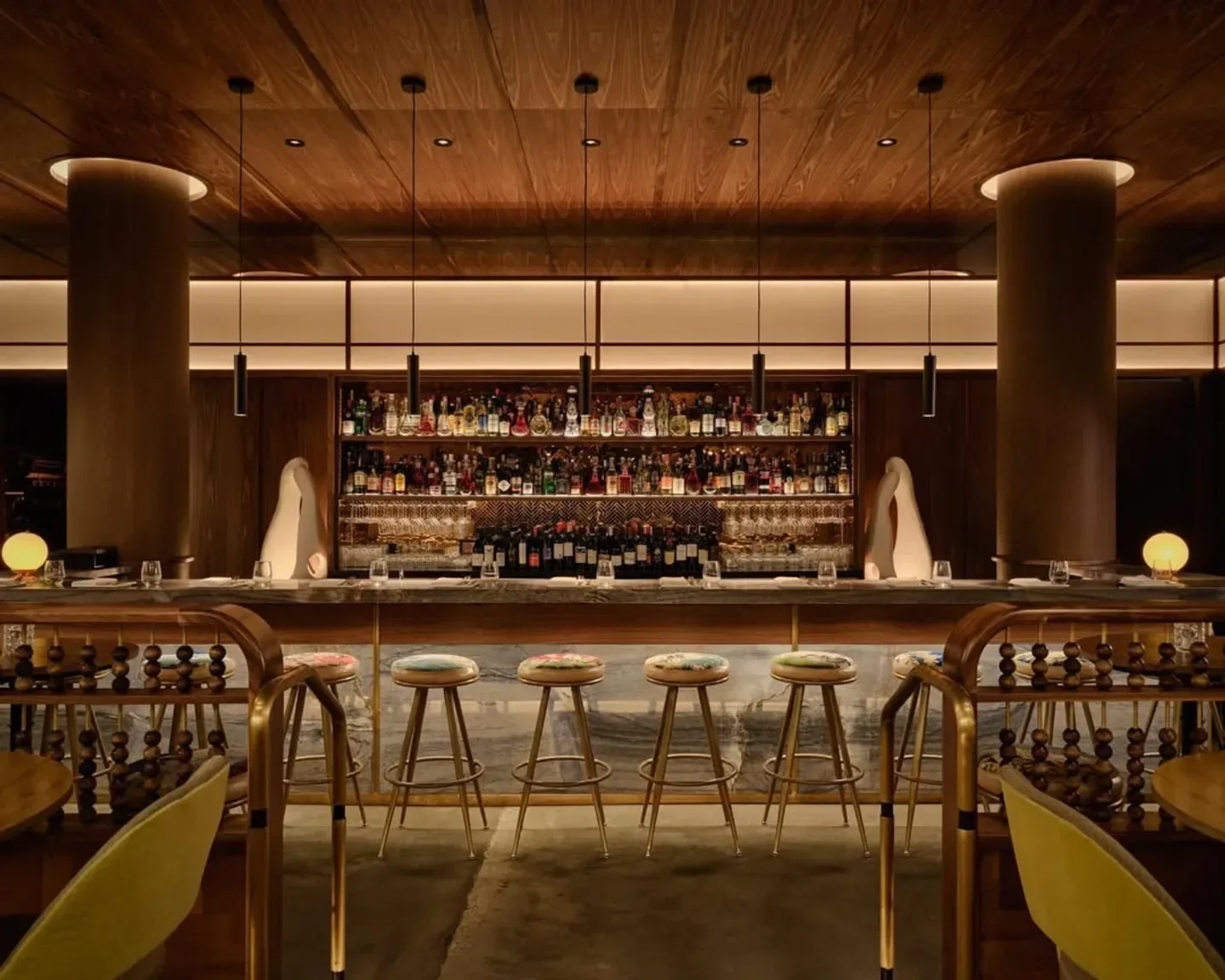 Interior of Lee Restaurant in Toronto with stylish bar and seating.