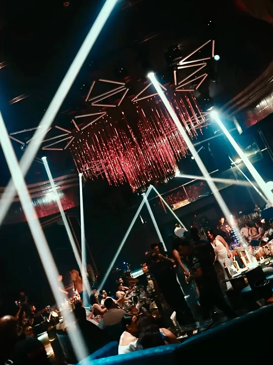 Les Etoiles Night Club in Abu Dhabi, vibrant nightlife with dazzling lights and crowd.