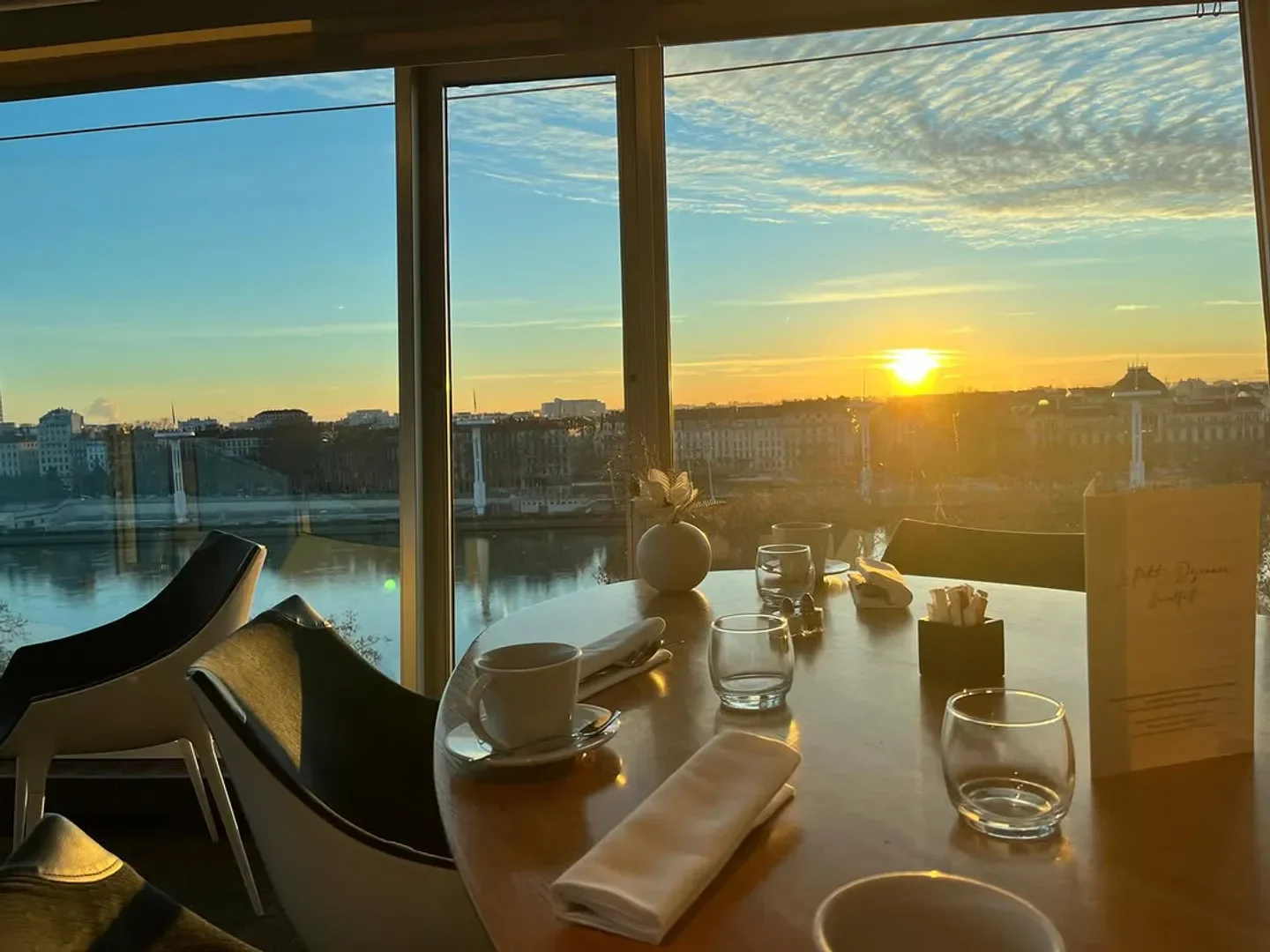 Les Trois Dômes restaurant in Lyon with stunning sunset view over the city.