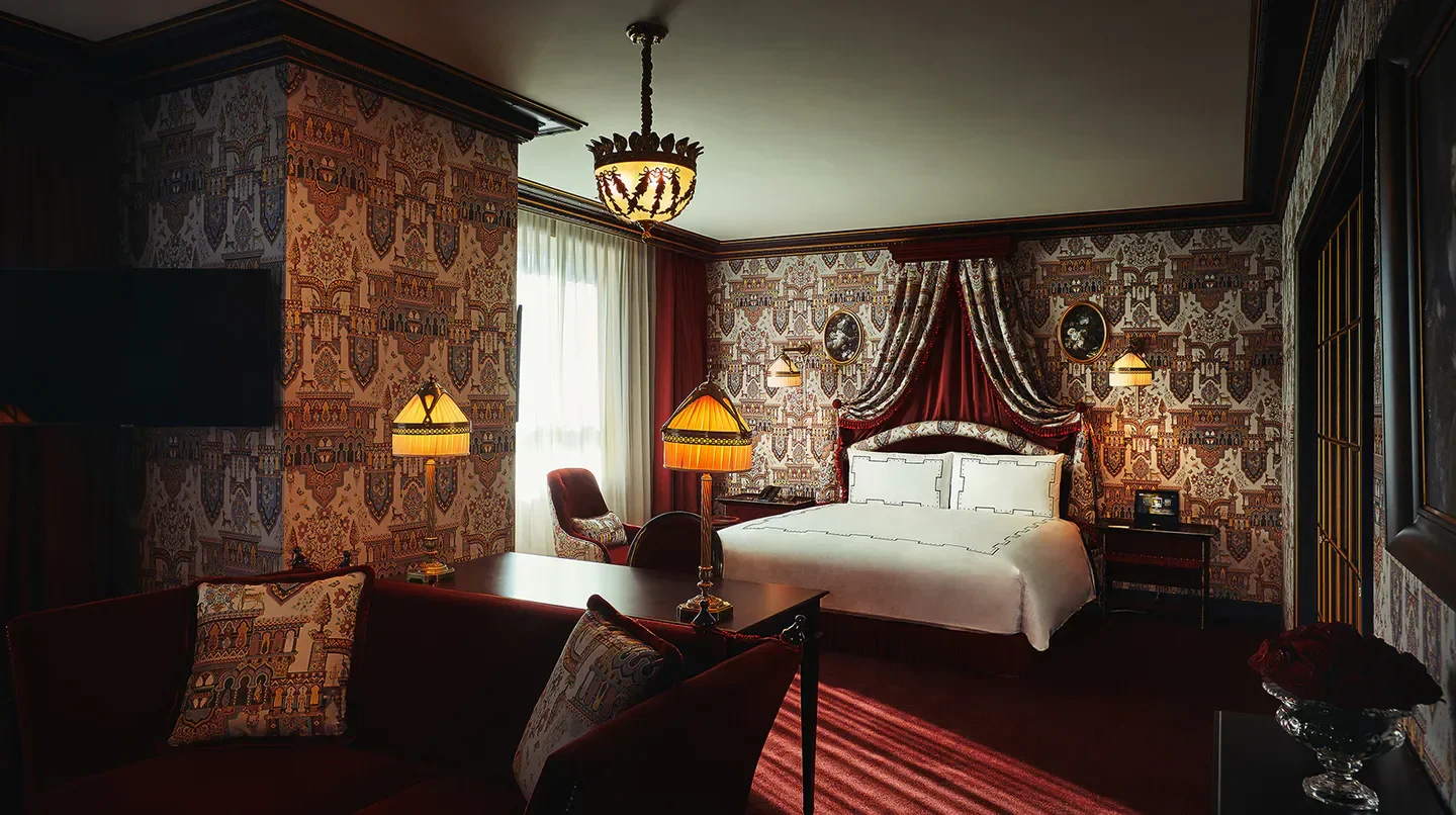 Elegant bedroom interior at L'Escape Hotel Seoul, featuring unique wallpaper design