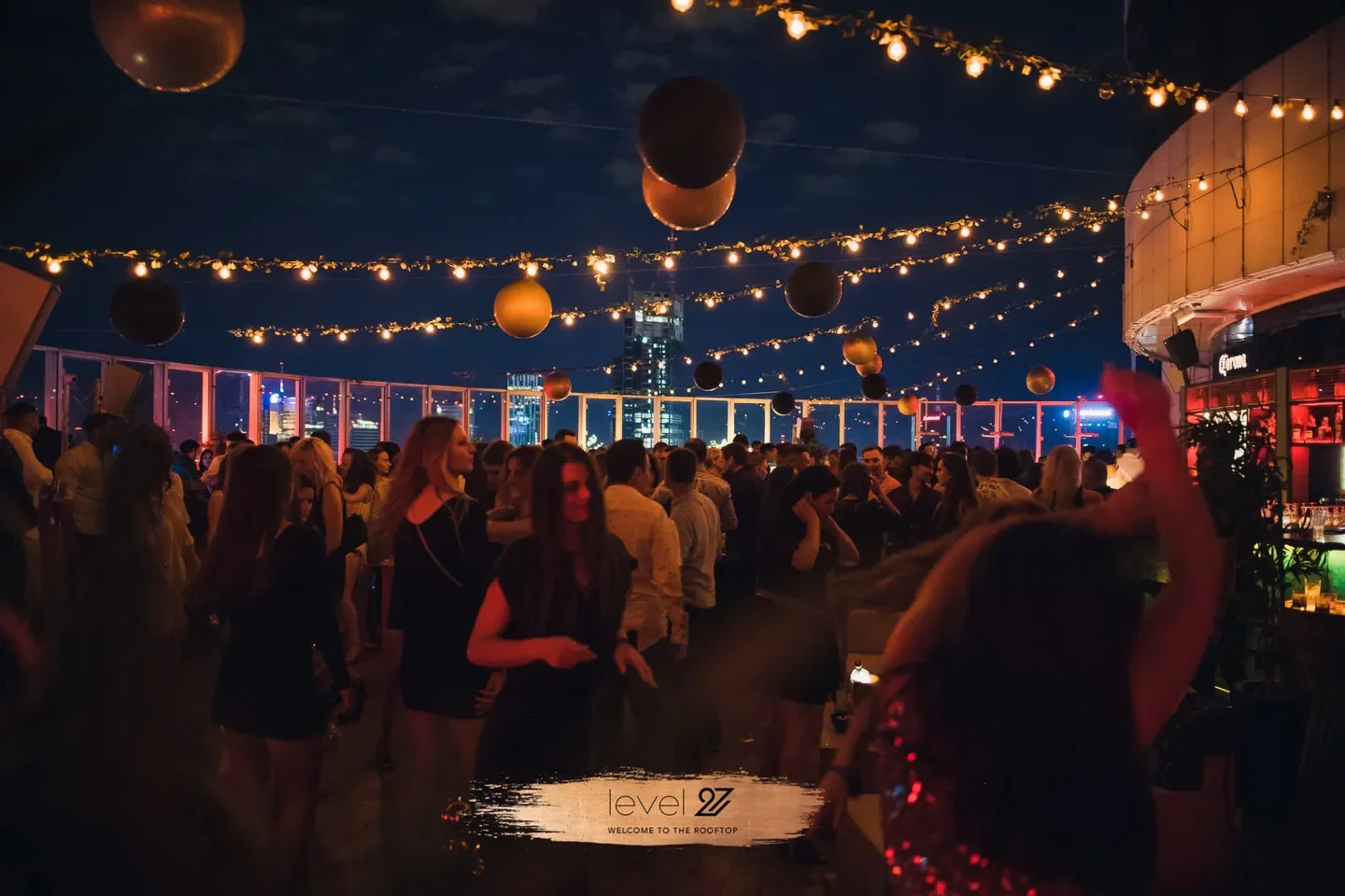 Nightclub scene at Level 27 in Warsaw with city views and festive atmosphere.