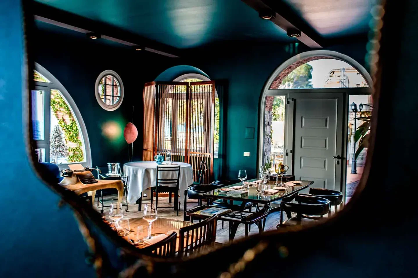 Interior dining space at Lido 84 restaurant, Lago di Garda, featuring unique architecture.