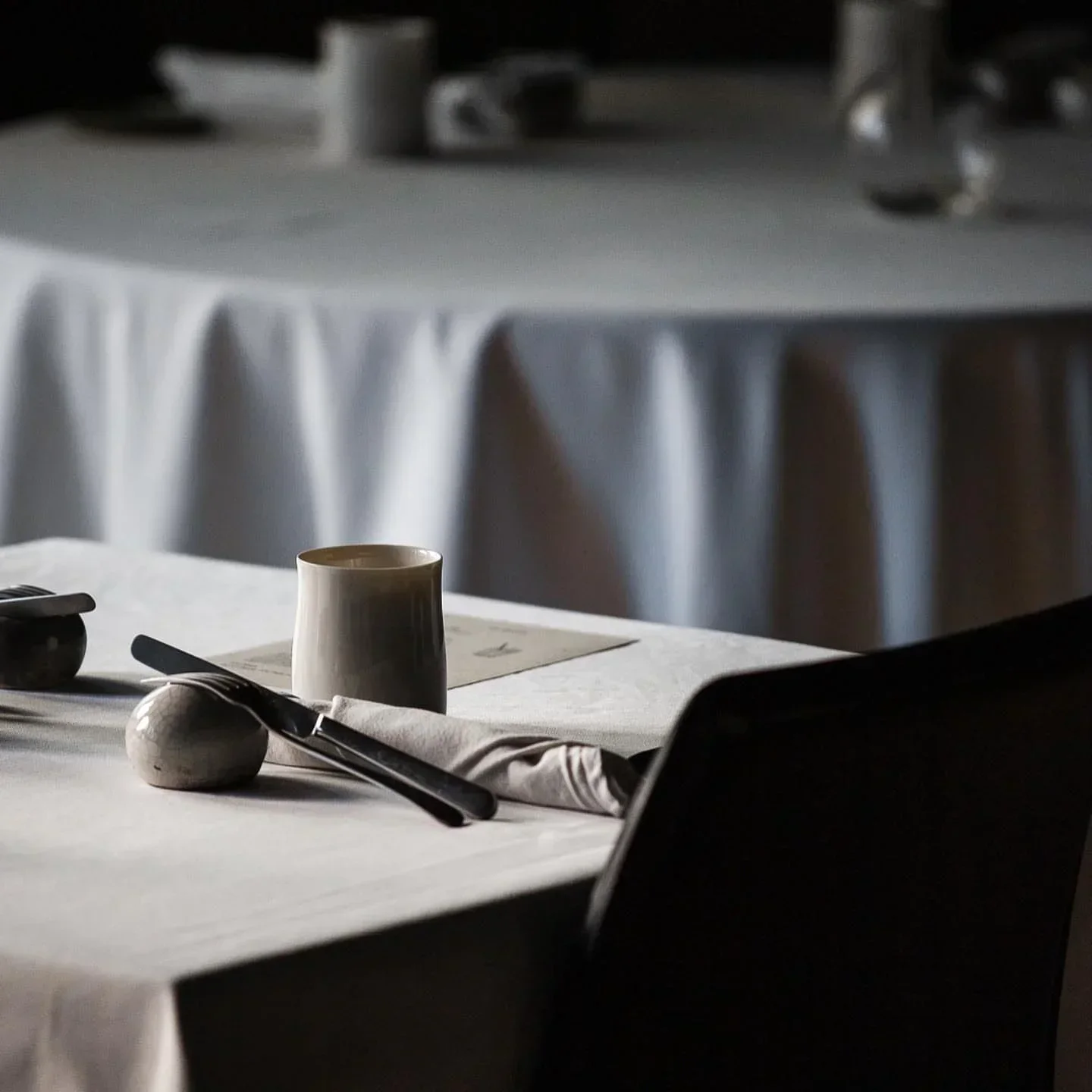 Elegant table setting at L'Impertinent restaurant in Biarritz, France.