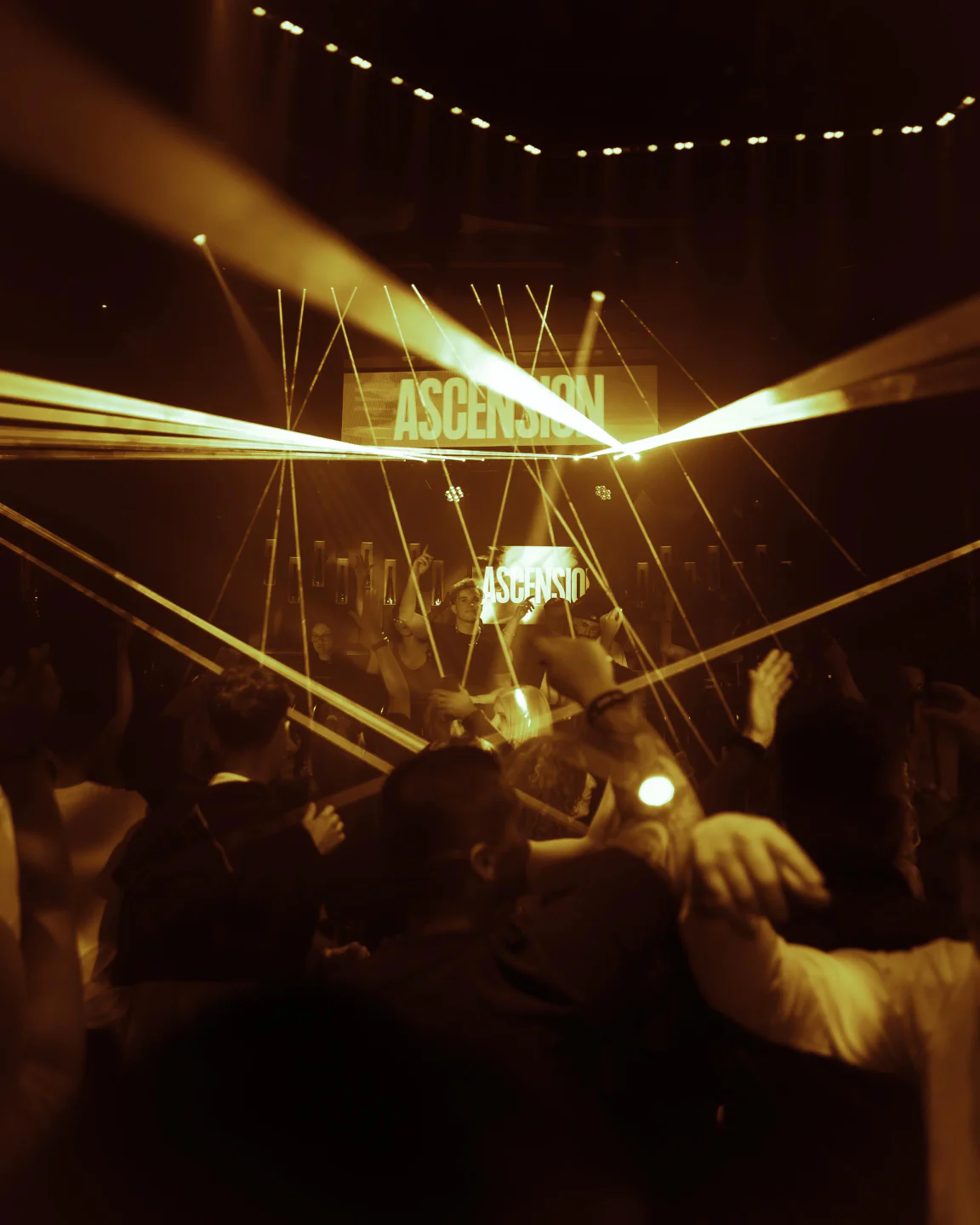 Laser show and "ASCENSION" logo illuminate the energetic crowd at Lio, Ibiza's vibrant nightlife hotspot.