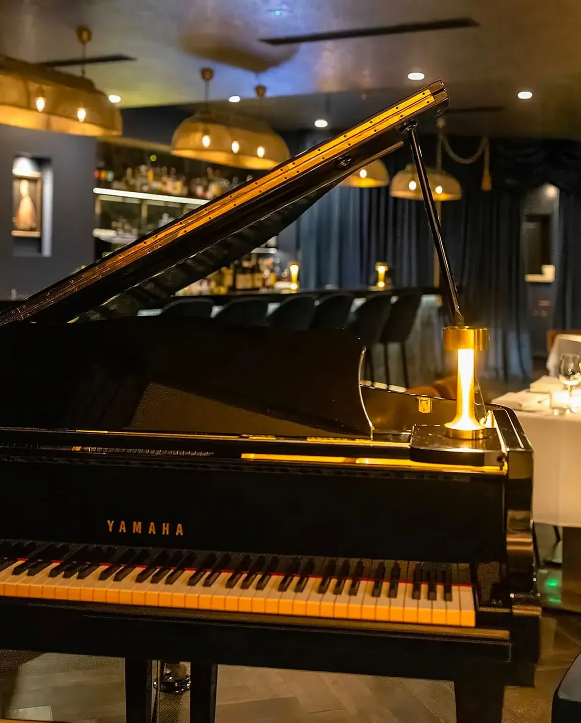 Grand piano at Little Truffle restaurant on the Gold Coast, ready for an evening of entertainment