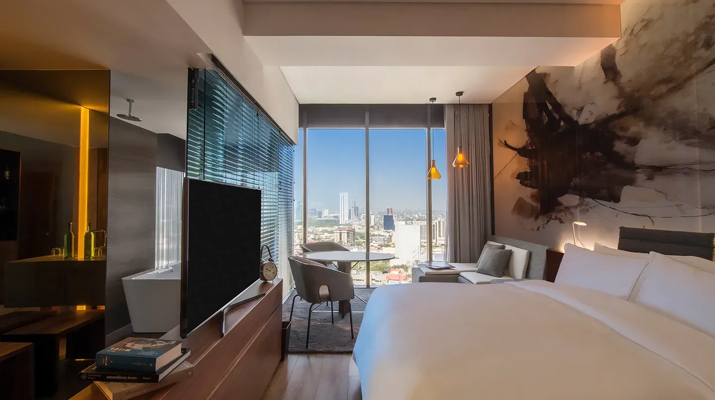 Modern suite at Live Aqua Urban Resort Monterrey with city views of Monterrey.