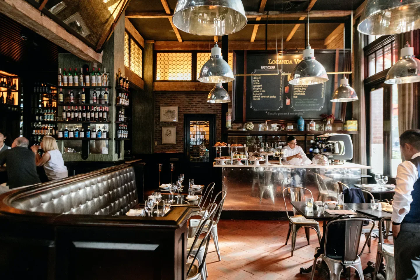 Interior of Locanda Verde restaurant in New York City with stylish decor and ambiance.