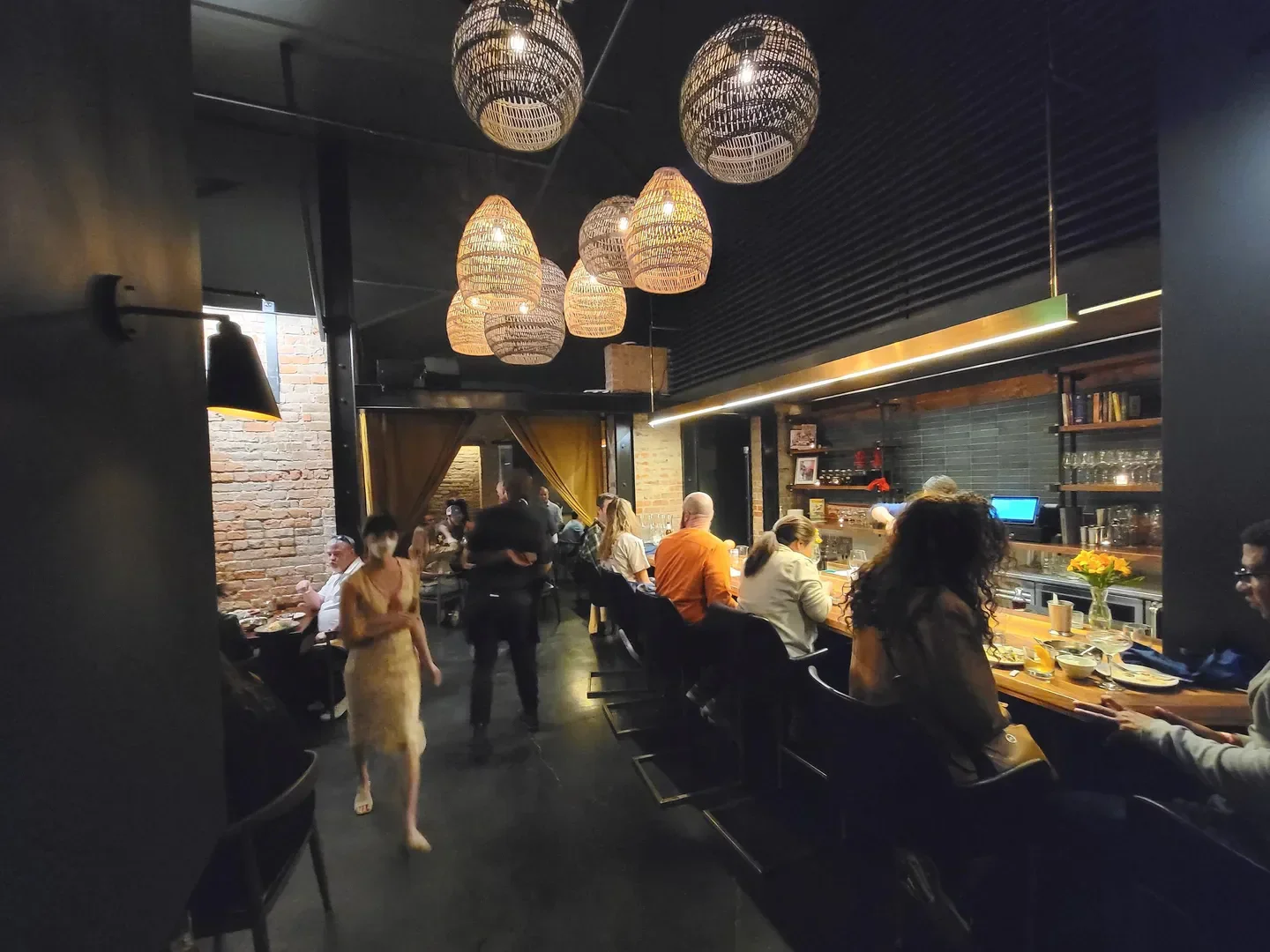 Interior of Lom Wong restaurant in Phoenix, featuring stylish lighting and dining area.