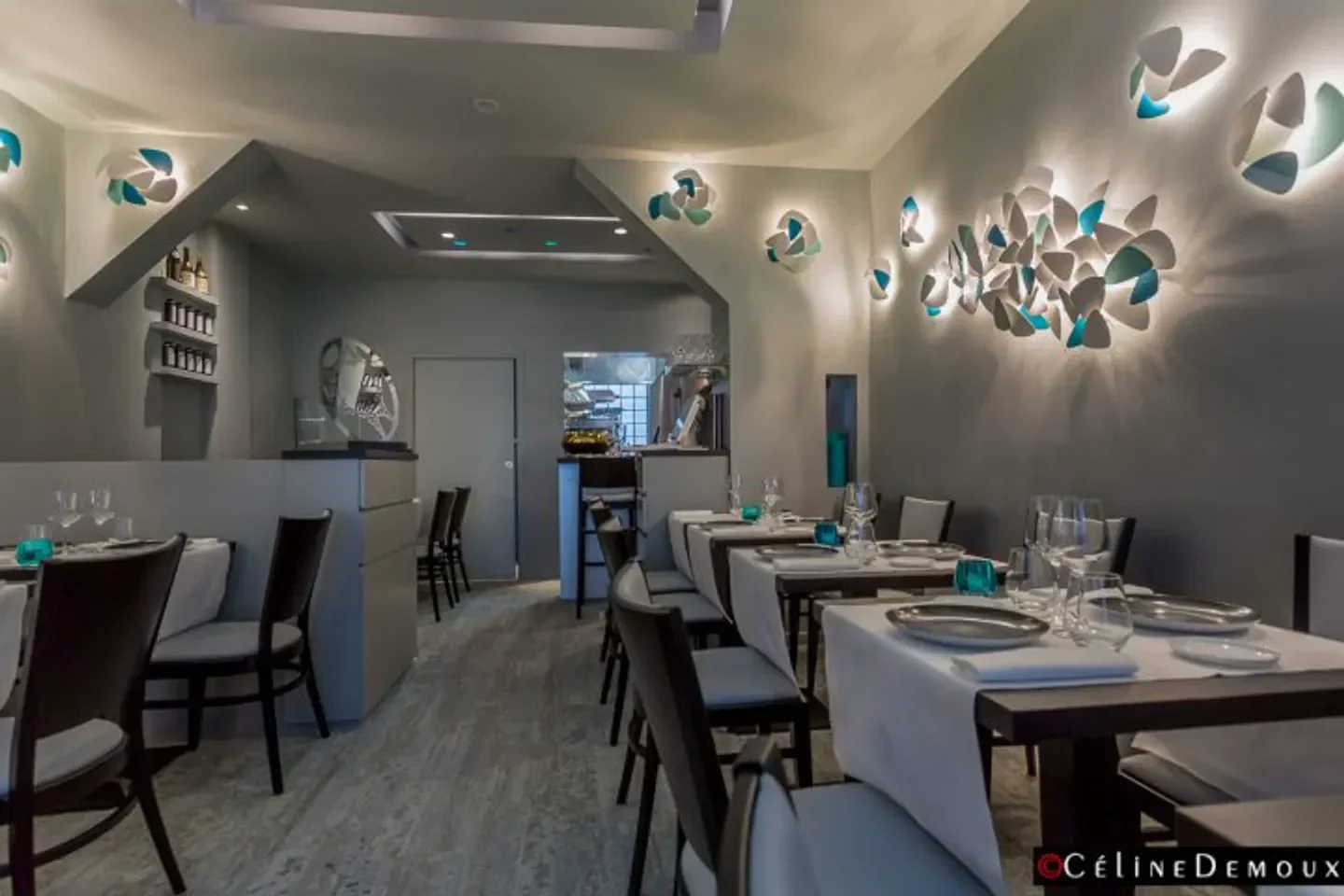 Interior of Louis restaurant in Paris, featuring stylish lighting and elegant dining setup.