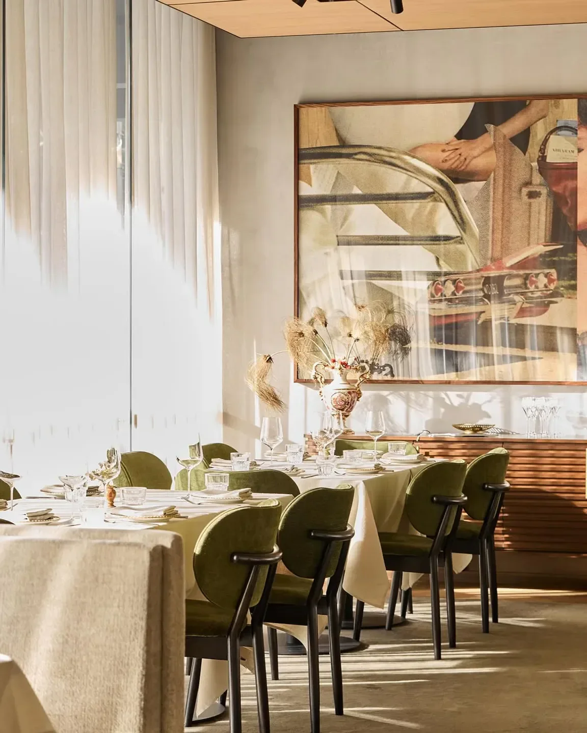 Elegant dining room at Lucia restaurant in Melbourne, featuring a prepared table setting.