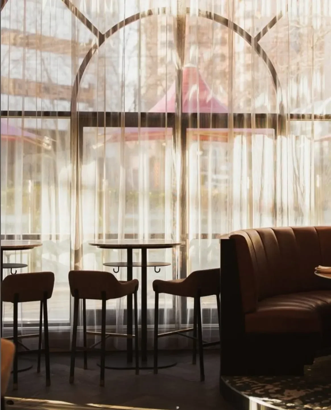 Interior of Luma Restaurant in Adelaide, with stylish seating and a bright window view.