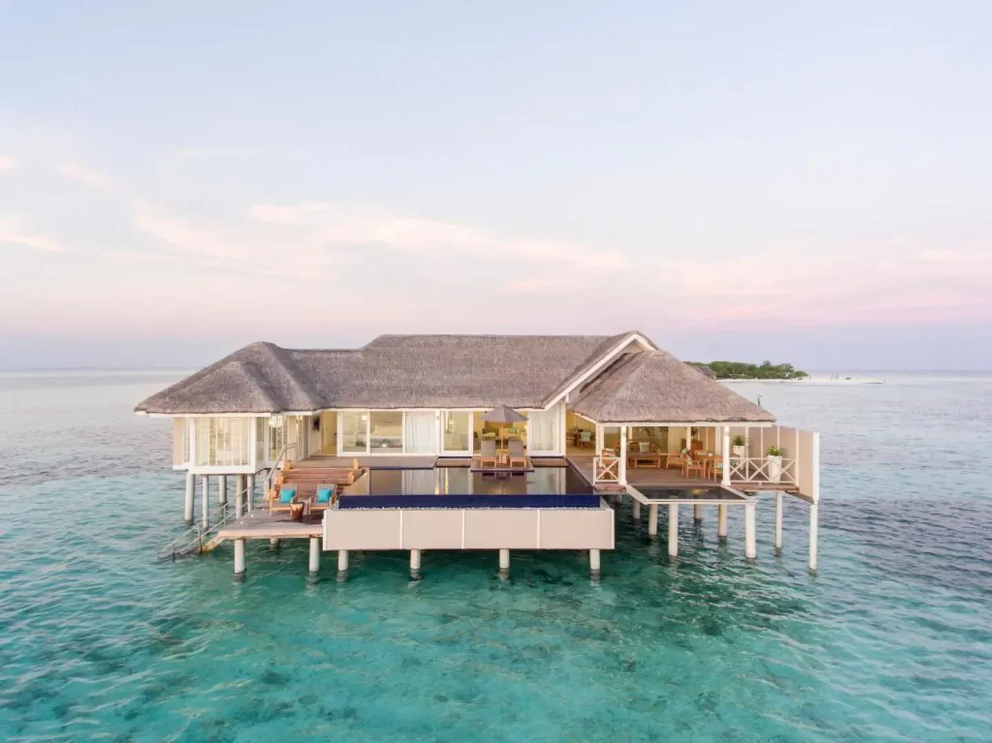 Luxury overwater bungalow at LUX* South Ari Atoll, Maldives, with stunning turquoise ocean views