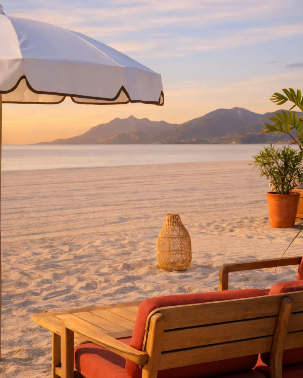 Mademoiselle Gray Plage Barrière beach club in Cannes with lounge chairs and umbrellas at sunset