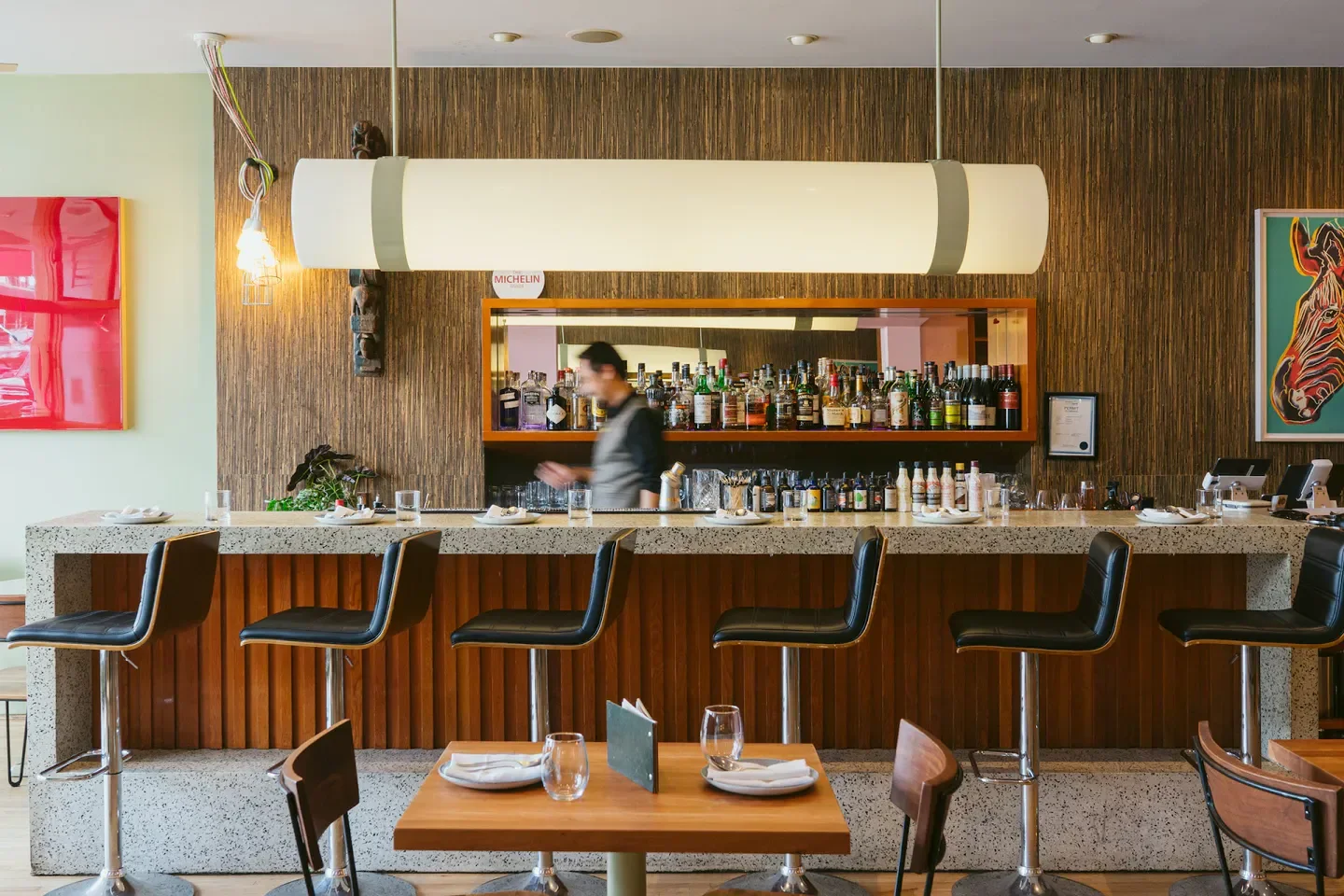 Interior bar at Maenam in Vancouver, showcasing stylish design and ambiance.